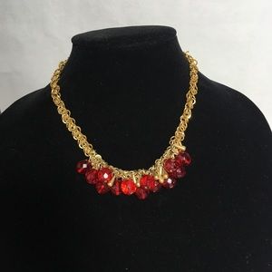 Red bead and gold tone necklace